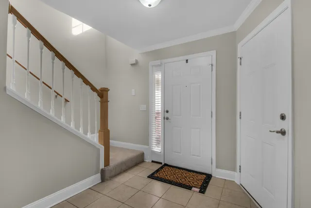 a view of entryway with stairs and a window