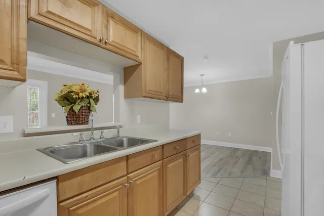 a kitchen with a sink and cabinets