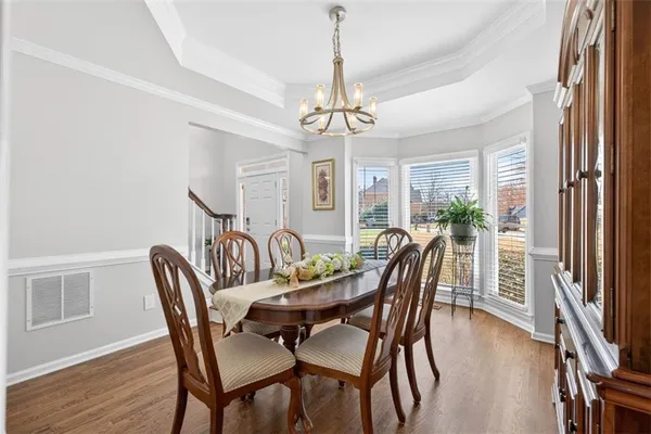 a bathroom with a granite countertop sink and a large mirror