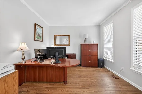a bedroom with a bed chair and window