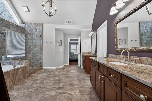 a living room with furniture pool table and windows