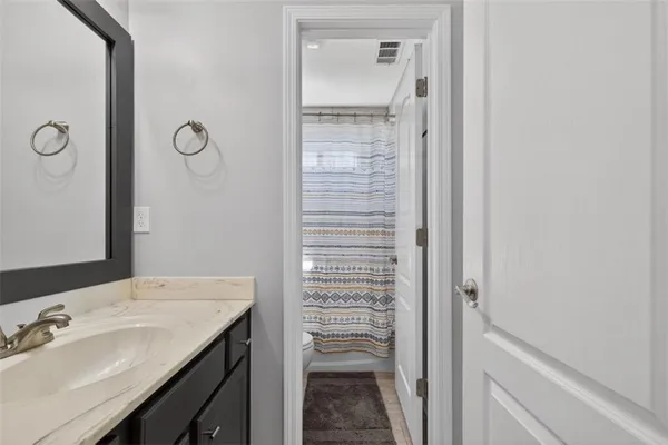 a front view of a house with yard porch and outdoor seating