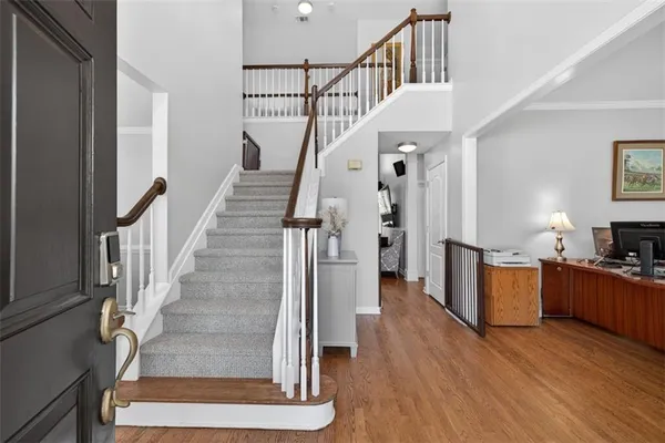 a living room with furniture a fireplace and a large window