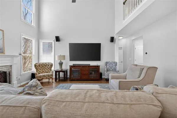 a living room with furniture and a flat screen tv