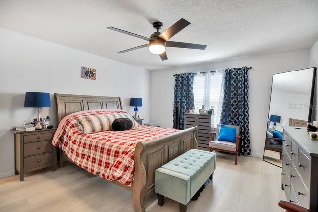 a bedroom with bed and a window