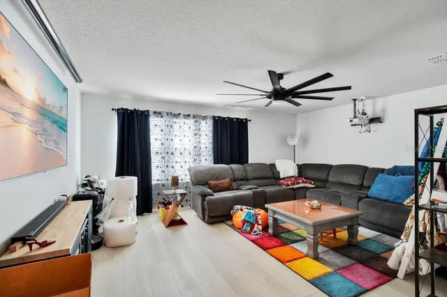 a living room with furniture and a window