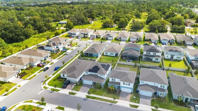 an aerial view of a house with a lake view