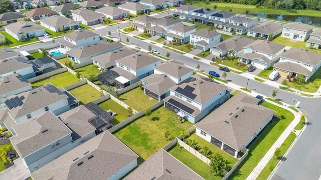 an aerial view of a house with a swimming pool
