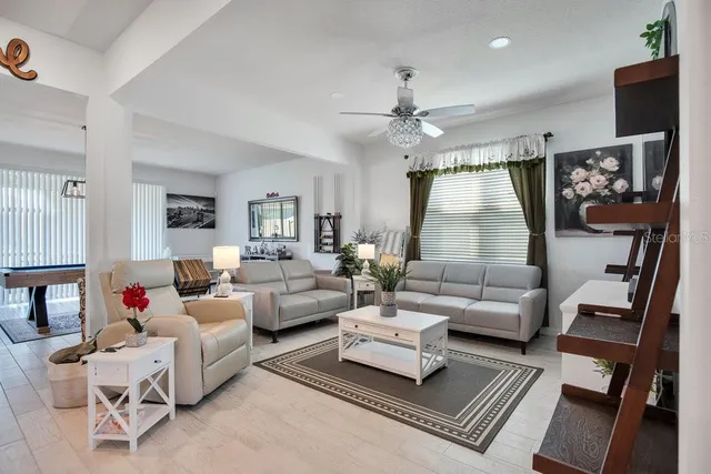 a living room with furniture or couch and a flat screen tv