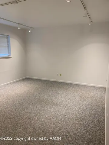an empty room with a bathroom