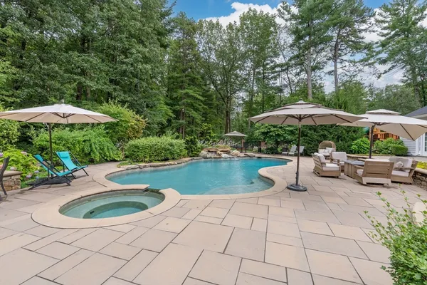 a view of a swimming pool with a patio