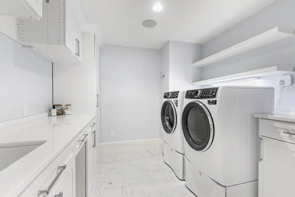 a utility room with dryer and washer