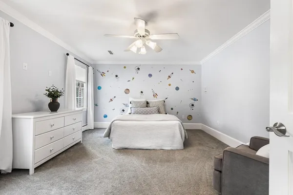 a bedroom with bed and window