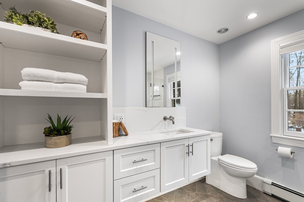40 Grandview Road Chelmsford, MA 01824 - Photo 27 of 42 a bathroom with a sink a toilet and with mirror