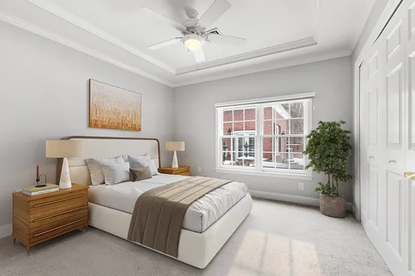 a spacious bedroom with a large bed and a large window