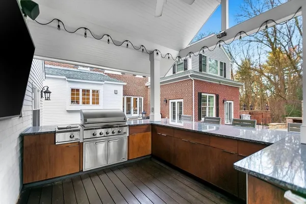 a kitchen with stainless steel appliances granite countertop a sink and cabinets
