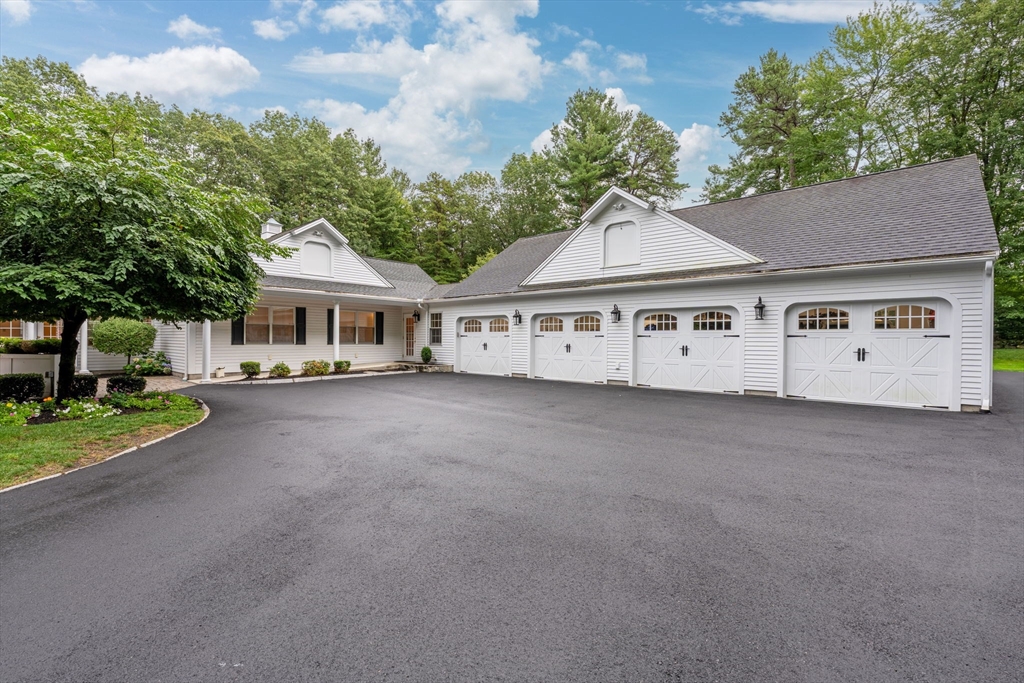 40 Grandview Road Chelmsford, MA 01824 - Photo 42 of 42 a view of a white house with a big yard and large trees