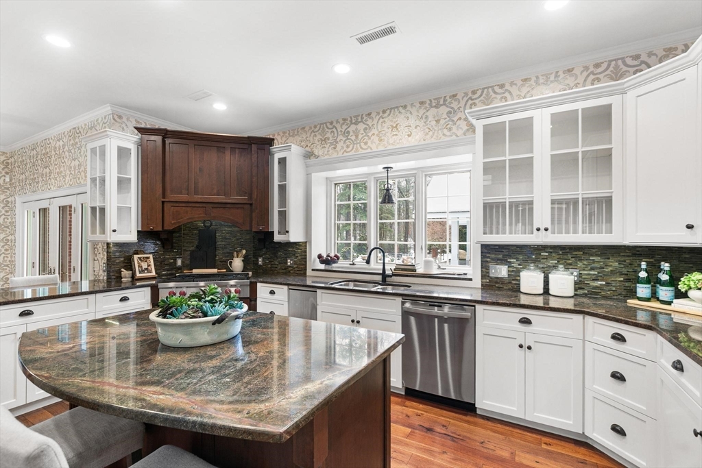 40 Grandview Road Chelmsford, MA 01824 - Photo 9 of 42 a kitchen with kitchen island granite countertop a sink and cabinets