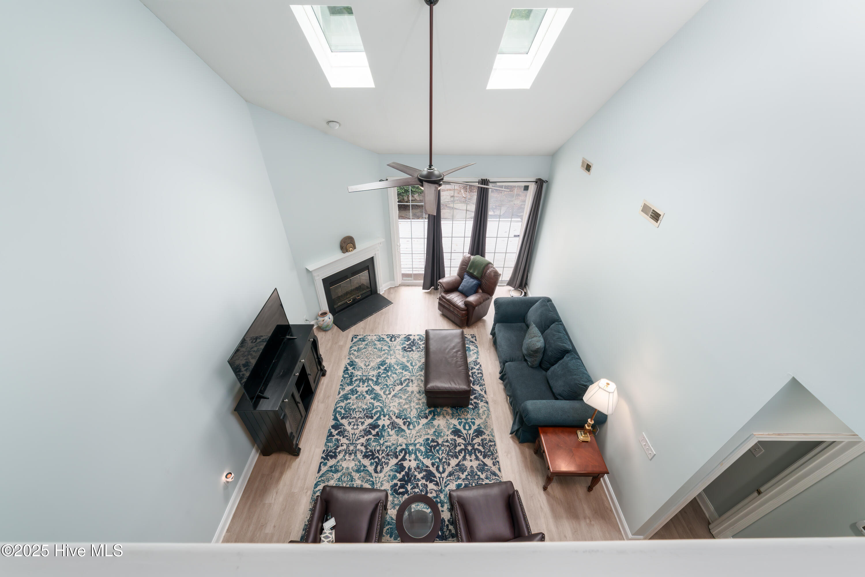 233 Racine Drive, Unit 85 Wilmington, NC 28403 - Photo 19 of 34 Upstairs loft looking in the Living room Downstairs