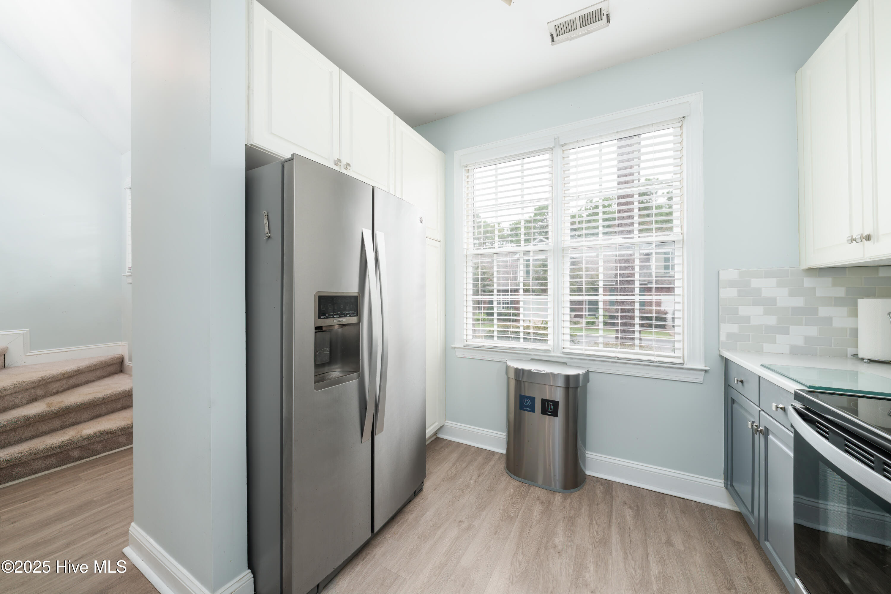 233 Racine Drive, Unit 85 Wilmington, NC 28403 - Photo 4 of 34 Kitchen sink looking back toward the front of the home