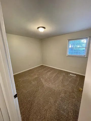 an empty room with a bench