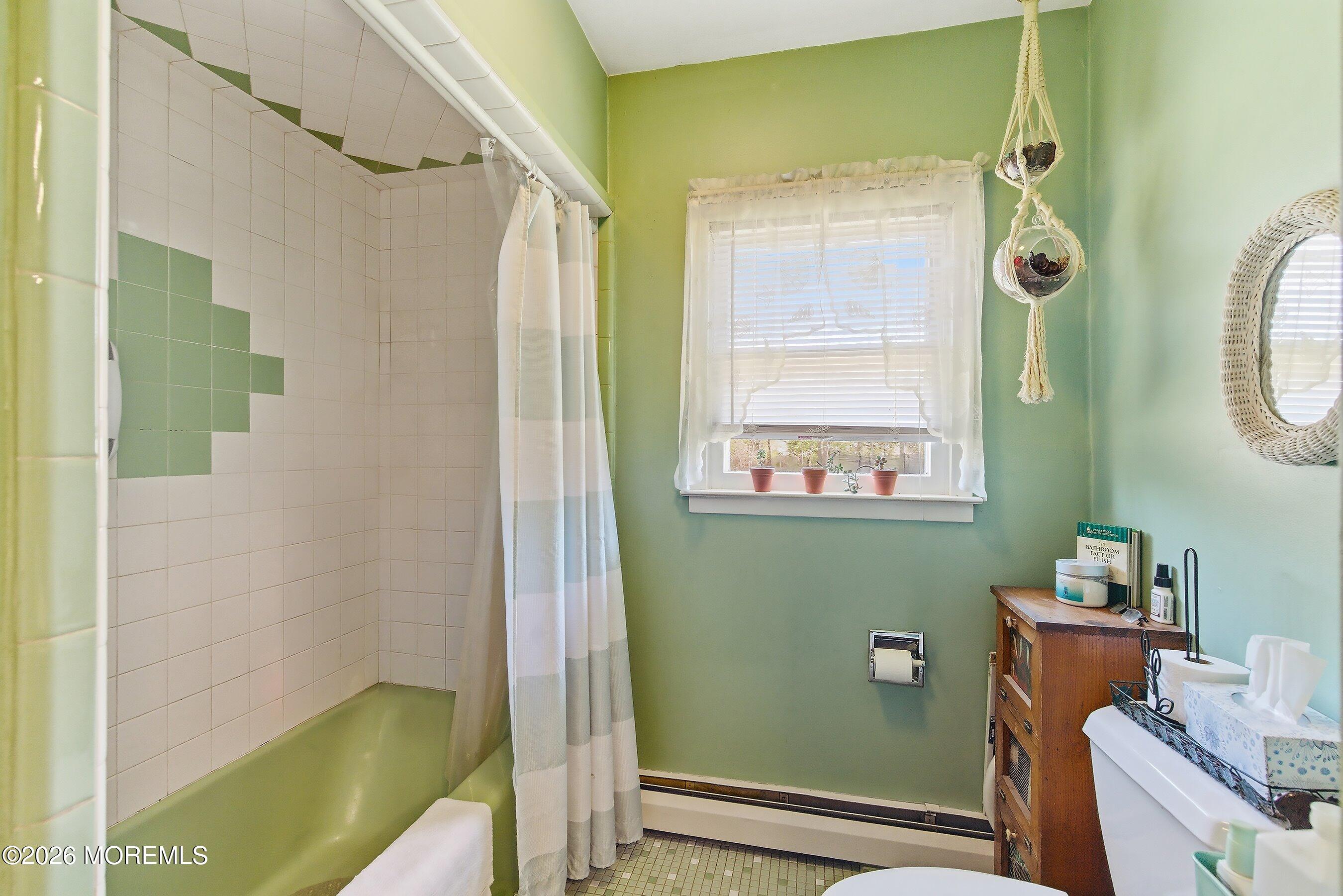 745 Oak Glen Road Howell, NJ 07731 - Photo 22 of 46 a bathroom with a mirror a sink and a shower