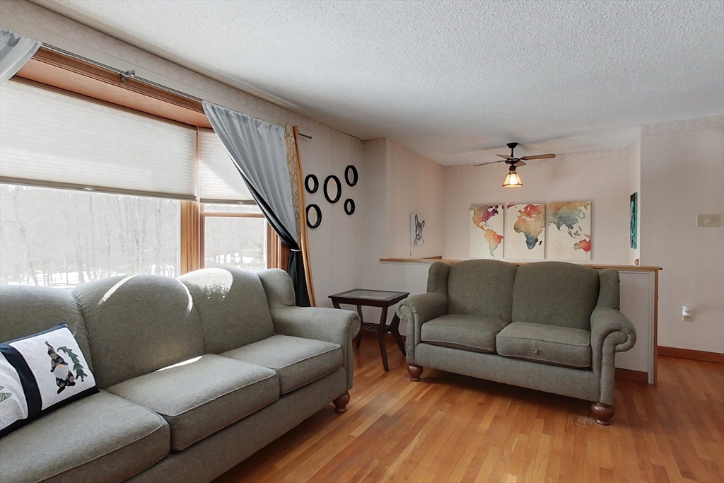 45 Watatic Mountain Road Ashby, MA 01431 - Photo 11 of 31 a living room with furniture and a large window