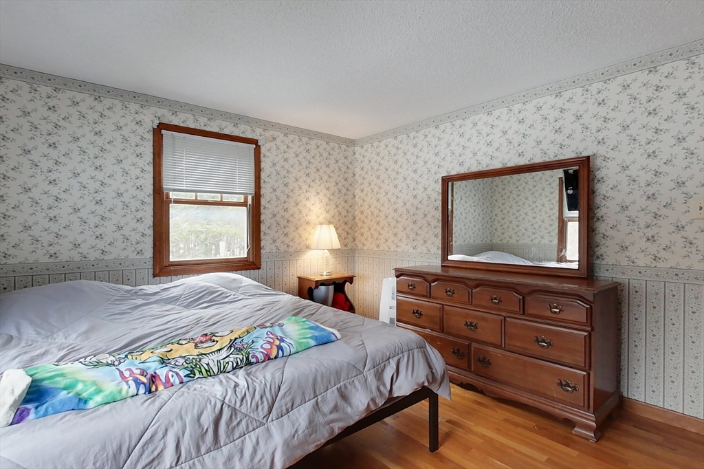 45 Watatic Mountain Road Ashby, MA 01431 - Photo 13 of 31 a bedroom with a bed and a dresser