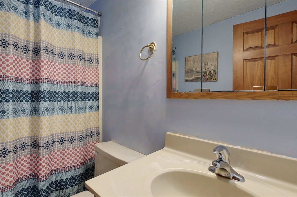 45 Watatic Mountain Road Ashby, MA 01431 - Photo 16 of 31 a bathroom with a sink and a mirror