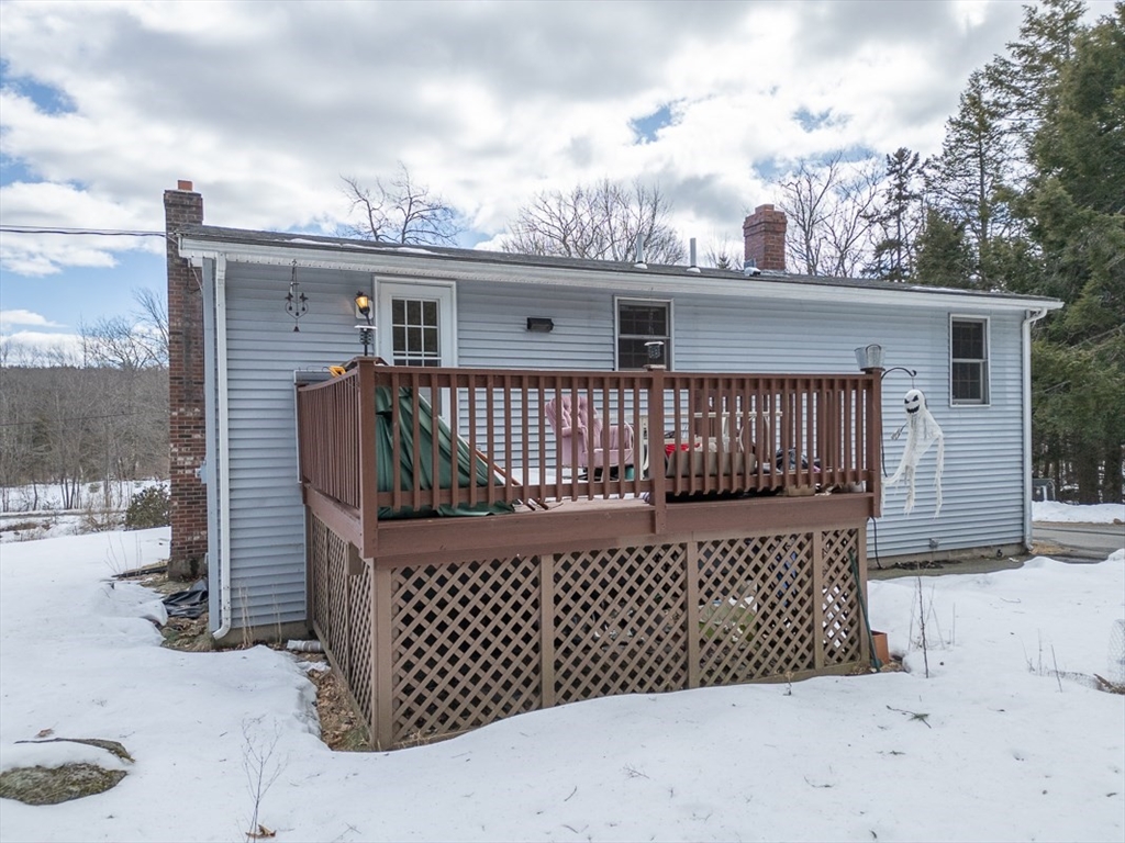 45 Watatic Mountain Road Ashby, MA 01431 - Photo 2 of 31 a view of a roof deck with couches and wooden floor