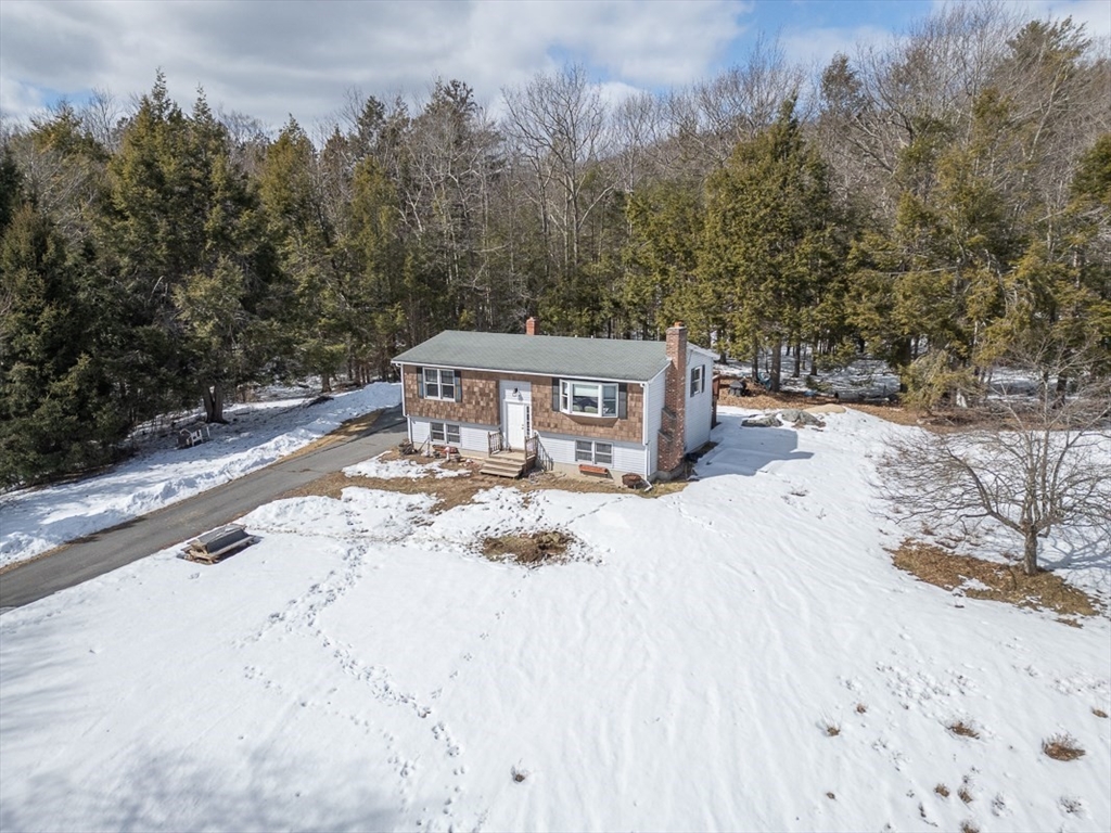 45 Watatic Mountain Road Ashby, MA 01431 - Photo 27 of 31 a house with trees in front of it