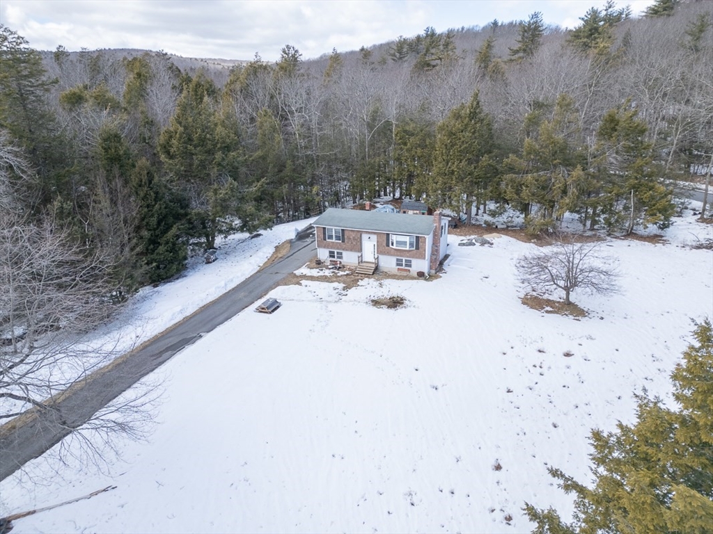 45 Watatic Mountain Road Ashby, MA 01431 - Photo 28 of 31 a view of a terrace with a bench
