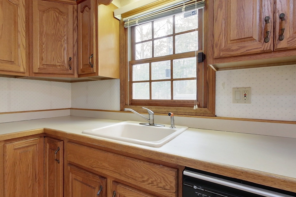 45 Watatic Mountain Road Ashby, MA 01431 - Photo 3 of 31 a bathroom with a sink and cabinets