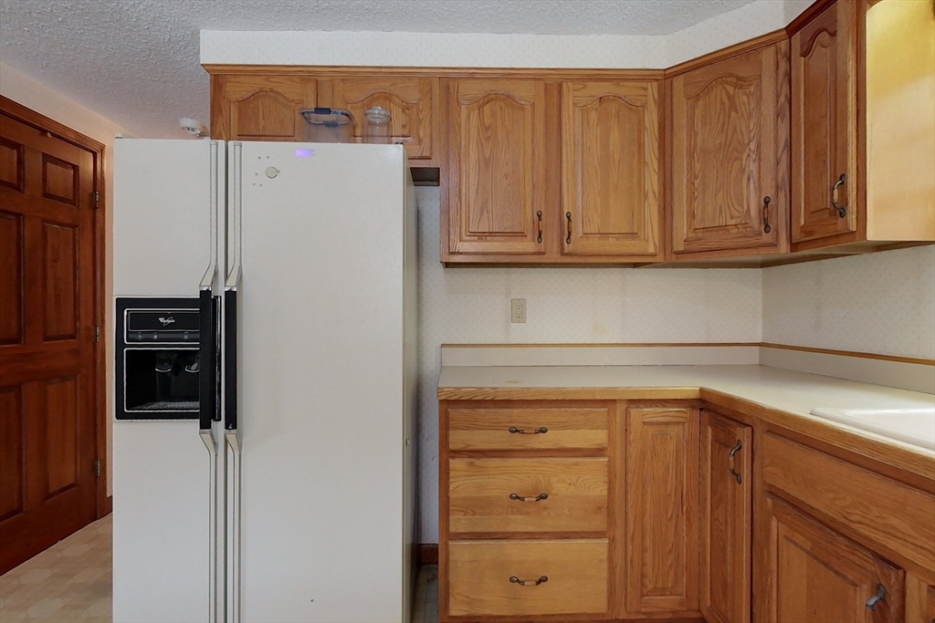 45 Watatic Mountain Road Ashby, MA 01431 - Photo 5 of 31 a white refrigerator freezer sitting in a kitchen