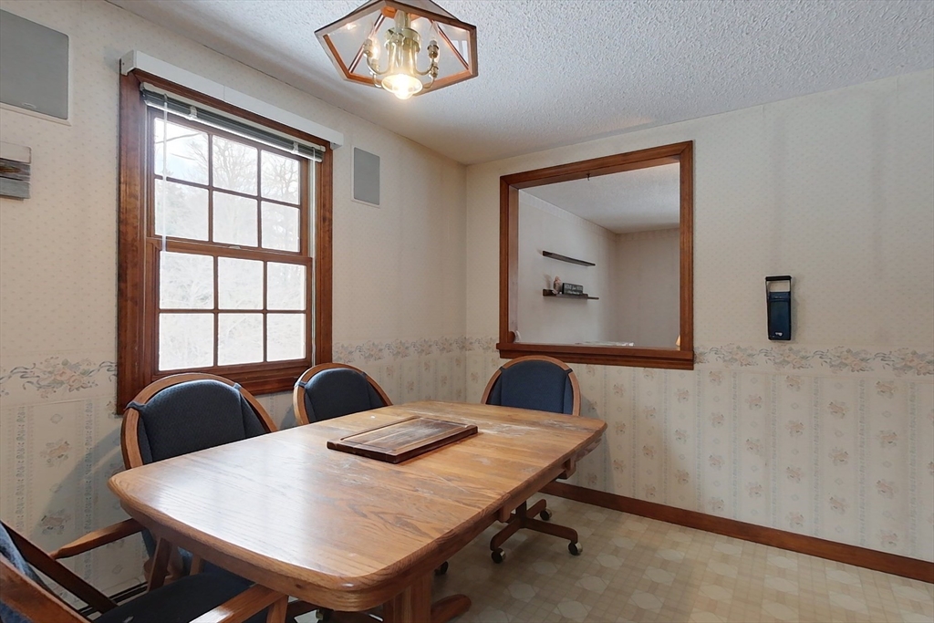 45 Watatic Mountain Road Ashby, MA 01431 - Photo 7 of 31 a view of a dining room with a table and chairs