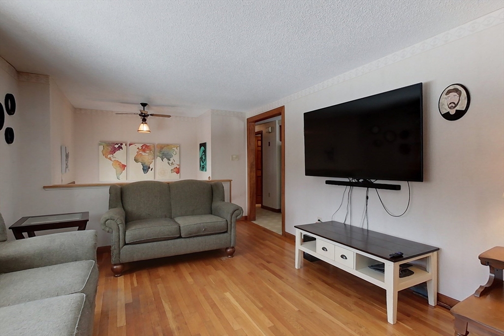 45 Watatic Mountain Road Ashby, MA 01431 - Photo 10 of 31 a living room with furniture and a flat screen tv