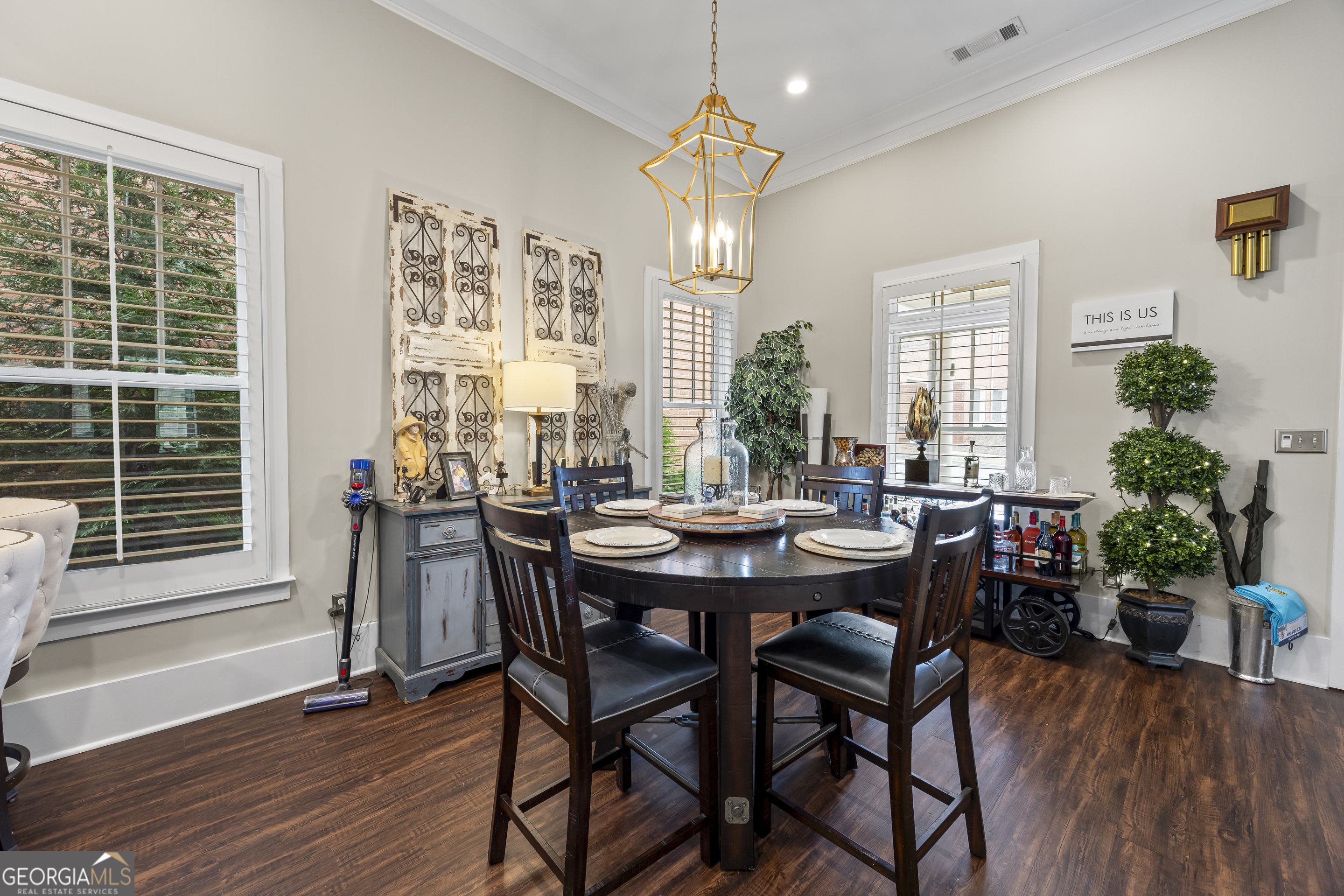 4121 North Swann Street Covington, GA 30014 - Photo 11 of 46 a view of a dining room with furniture window and wooden floor