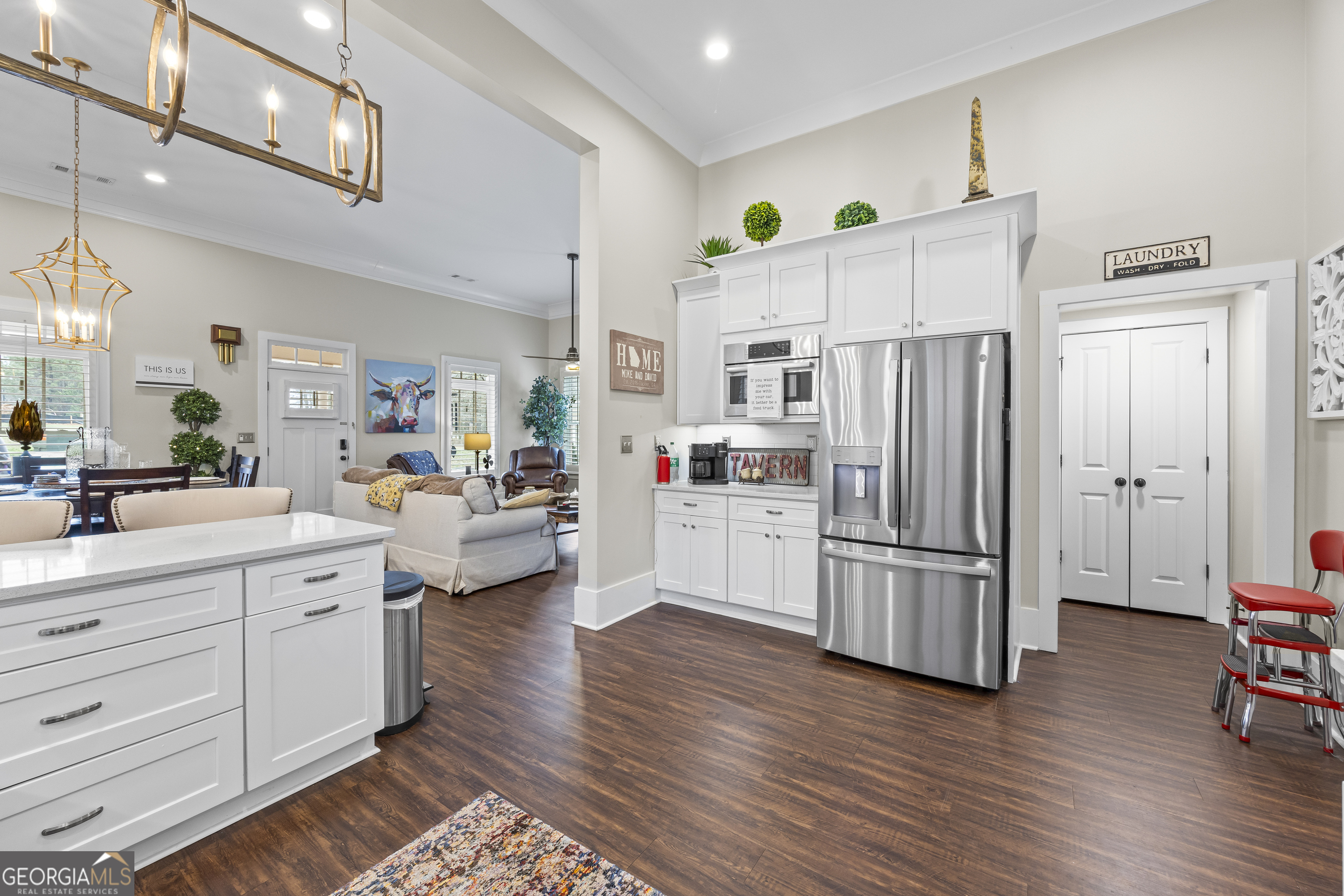 4121 North Swann Street Covington, GA 30014 - Photo 17 of 46 a kitchen with stainless steel appliances a refrigerator sink and cabinets