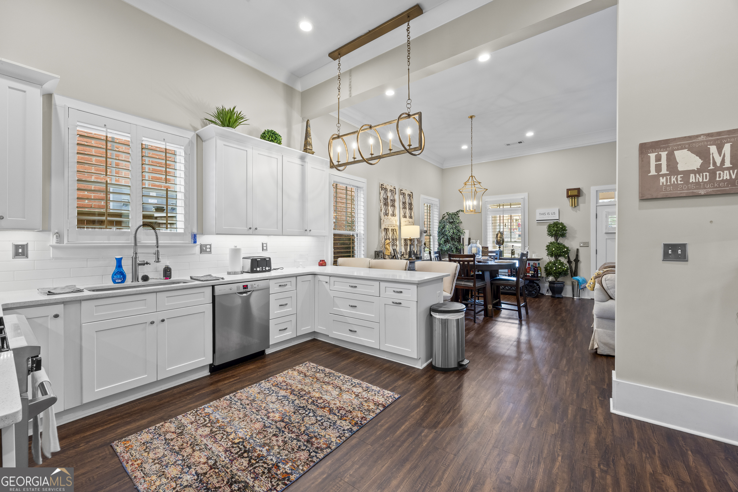 4121 North Swann Street Covington, GA 30014 - Photo 18 of 46 a large white kitchen with lots of counter space and windows