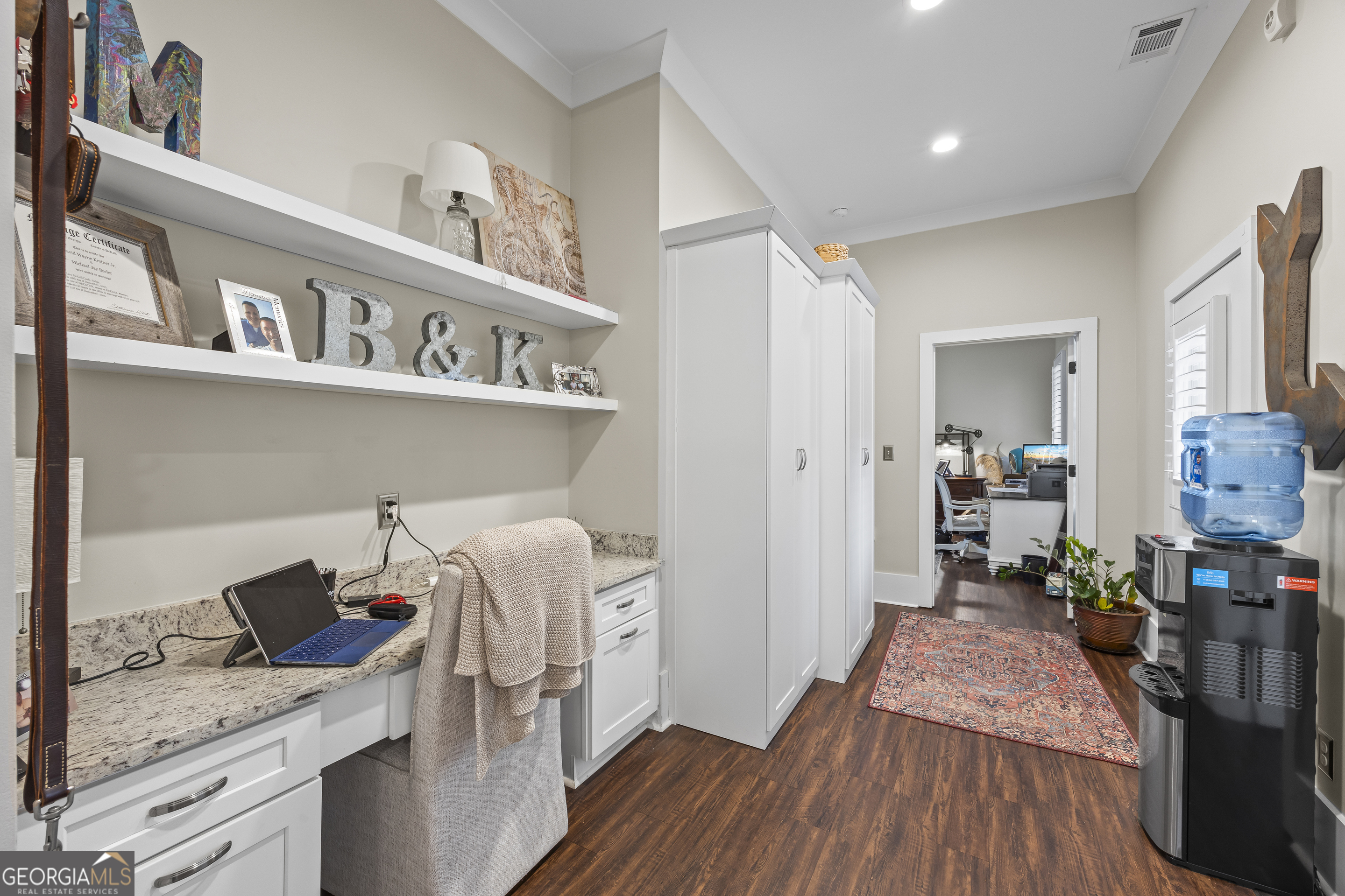 4121 North Swann Street Covington, GA 30014 - Photo 19 of 46 a workspace with furniture and wooden floor