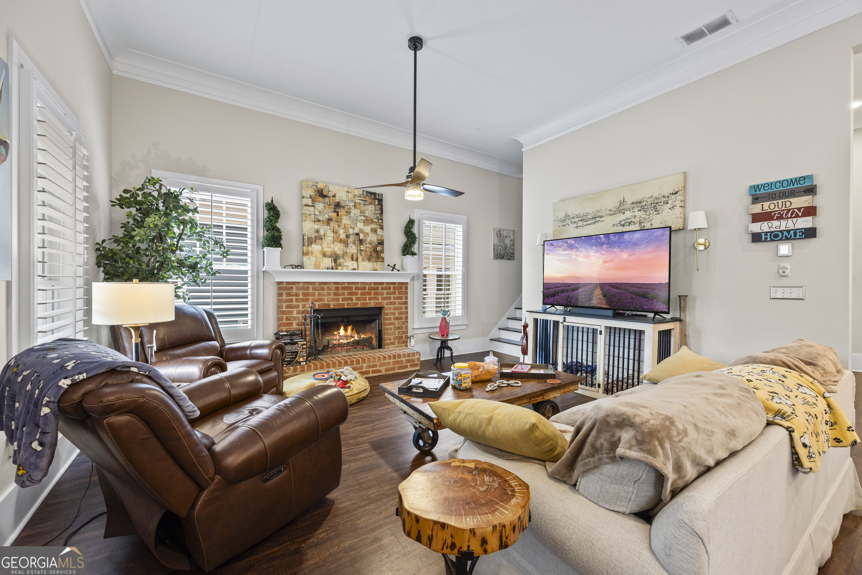 4121 North Swann Street Covington, GA 30014 - Photo 2 of 46 a living room with furniture a fireplace and a flat screen tv