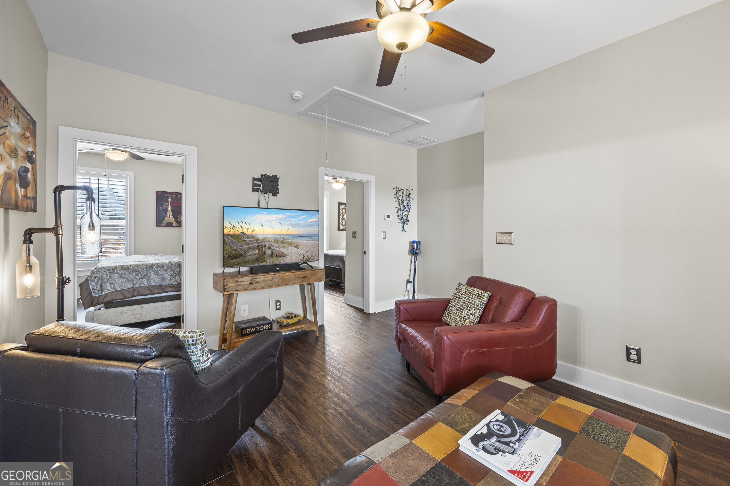 4121 North Swann Street Covington, GA 30014 - Photo 28 of 46 a living room with furniture and a flat screen tv