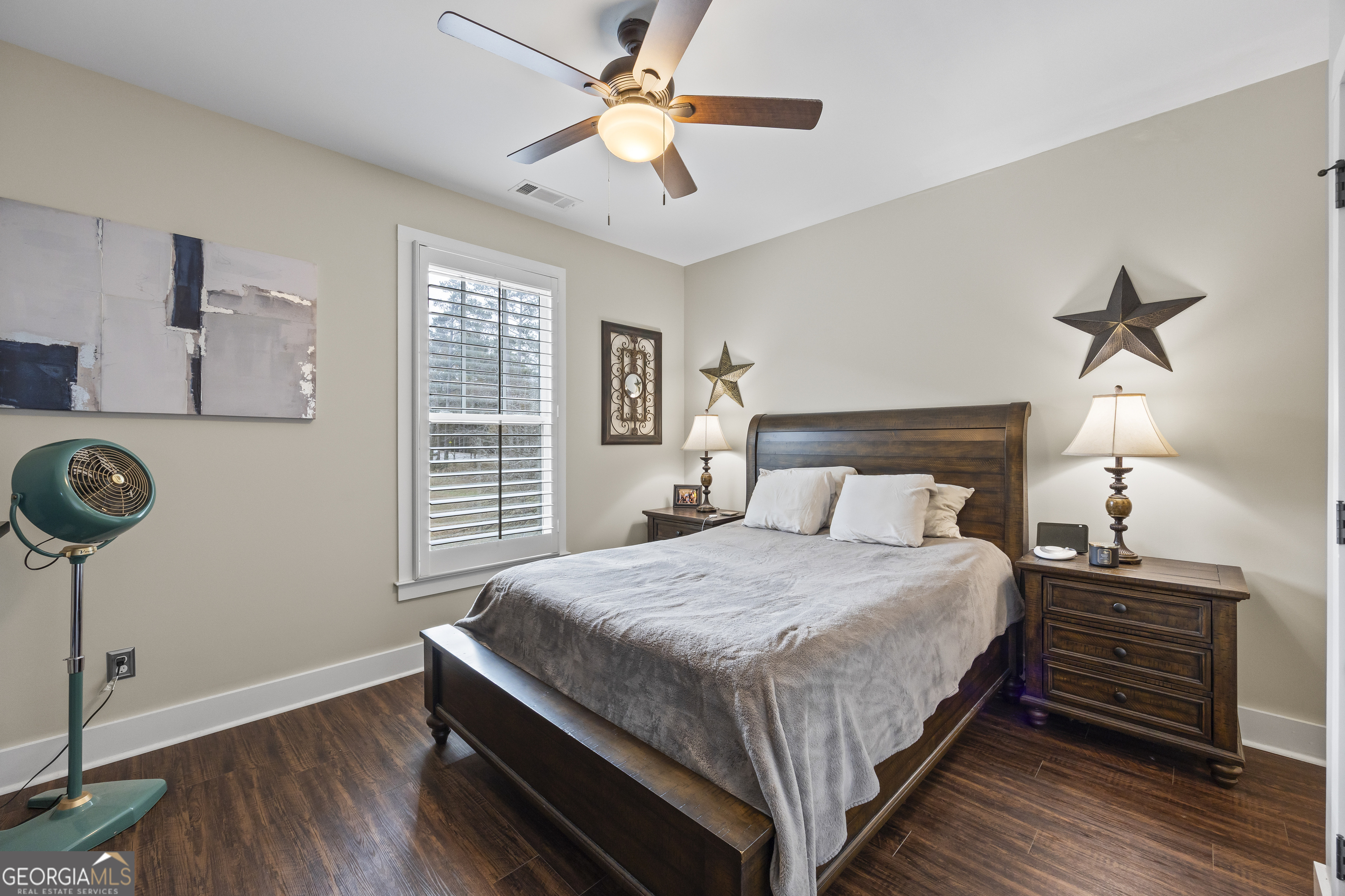 4121 North Swann Street Covington, GA 30014 - Photo 29 of 46 a bedroom with a bed and a chandelier