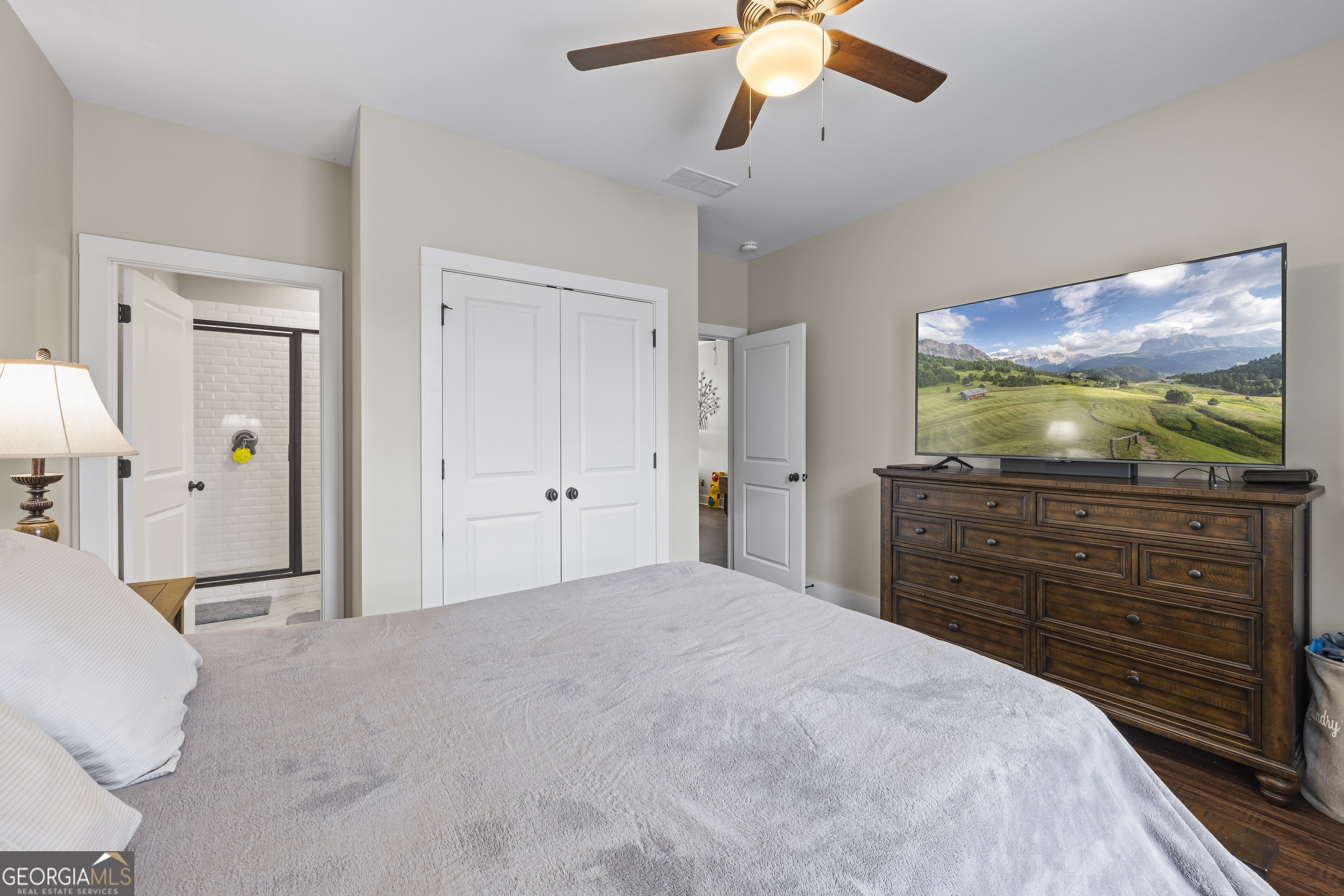 4121 North Swann Street Covington, GA 30014 - Photo 30 of 46 a bedroom with a bed and a flat screen tv