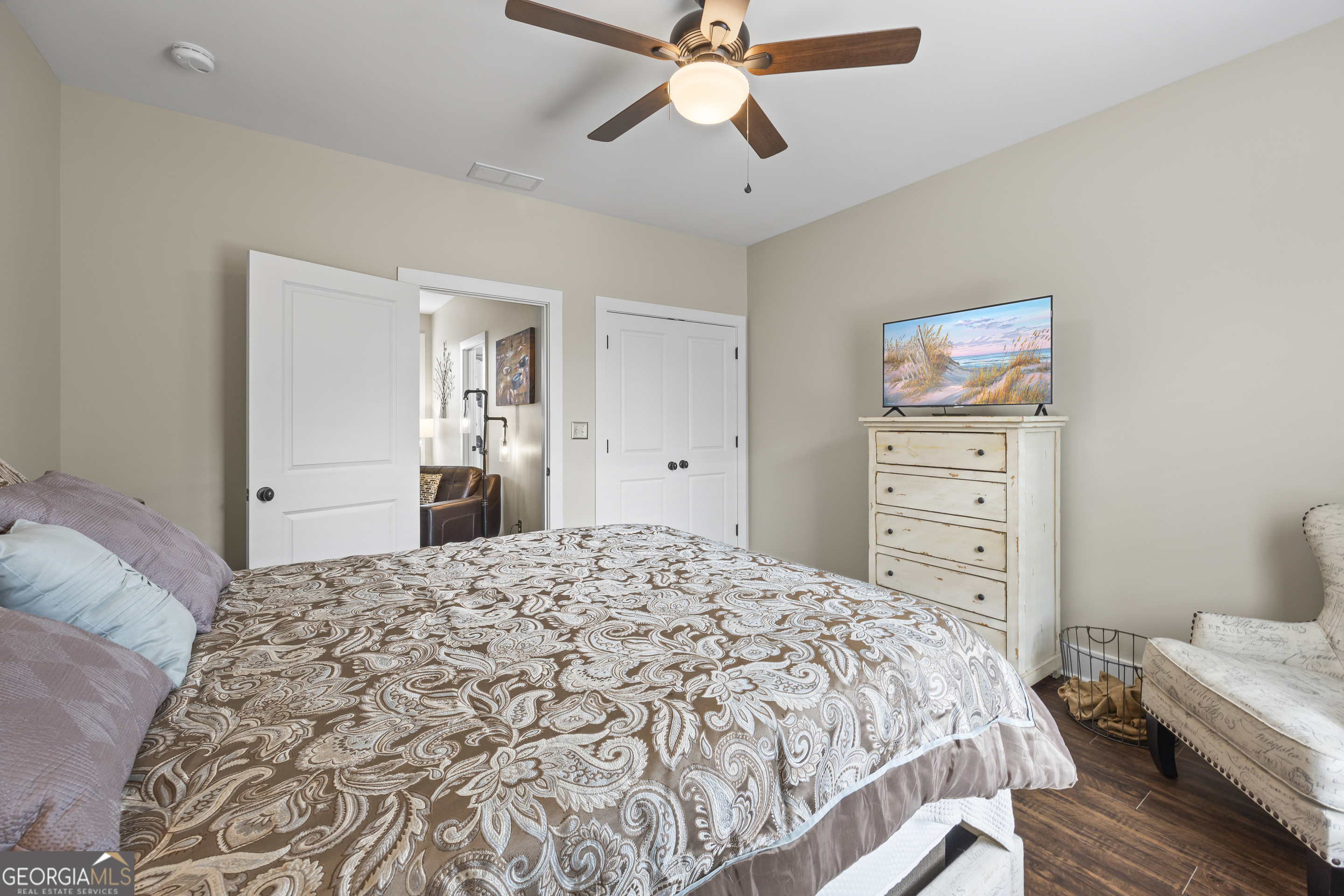 4121 North Swann Street Covington, GA 30014 - Photo 34 of 46 a bedroom with a bed and a chandelier