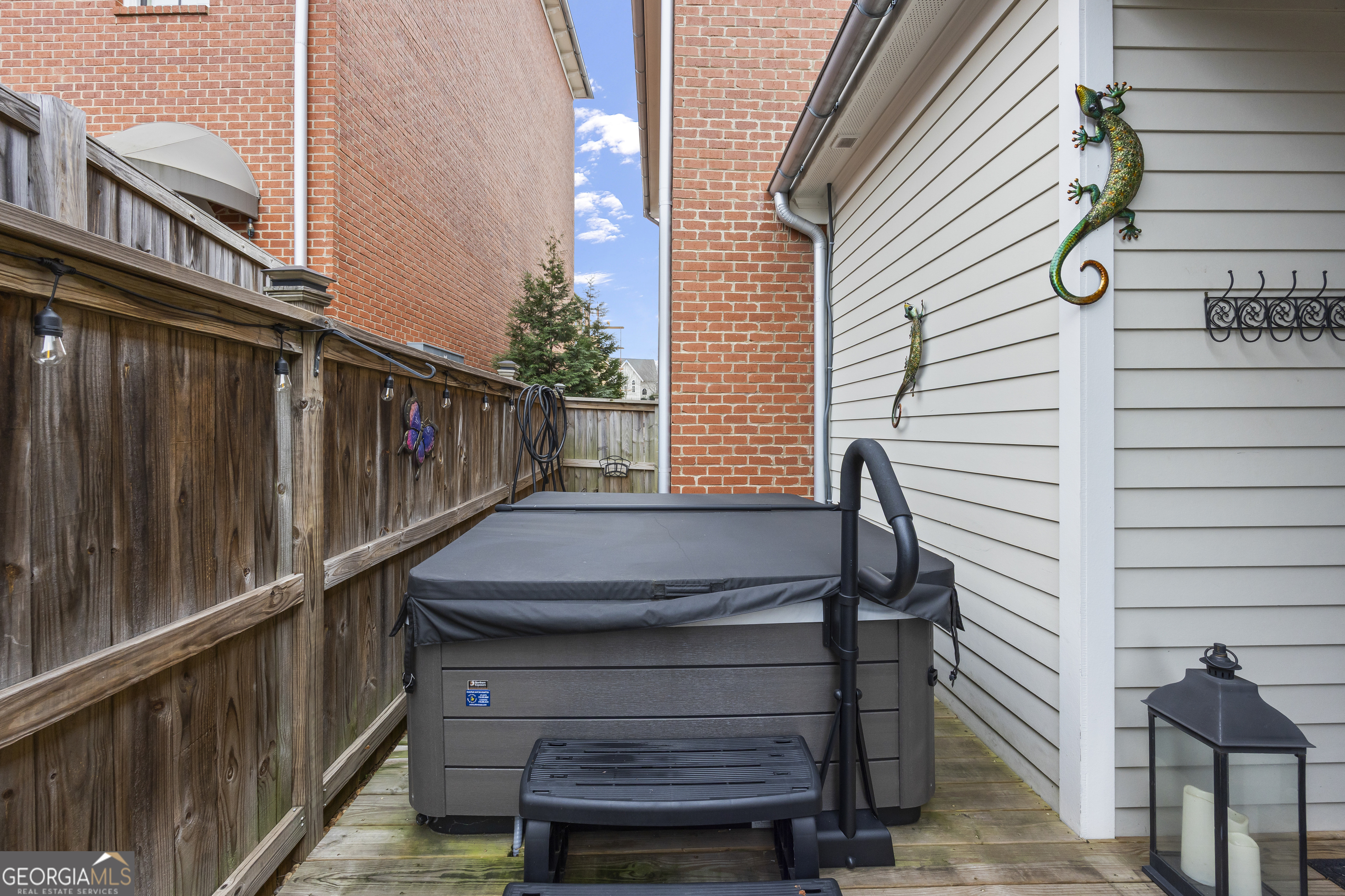 4121 North Swann Street Covington, GA 30014 - Photo 37 of 46 a view of balcony with wooden floor and stairs