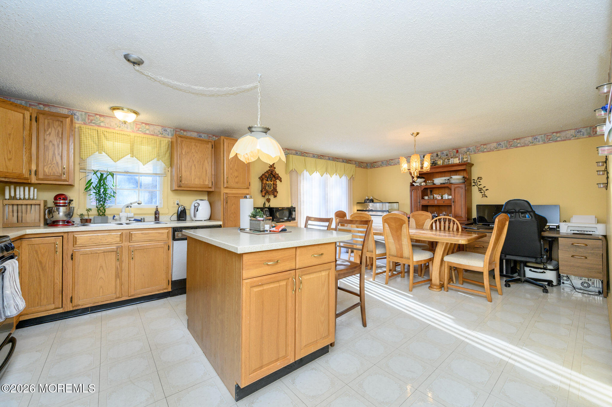 33 Compass Lane Barnegat, NJ 08005 - Photo 7 of 30 a kitchen with cabinets and chairs