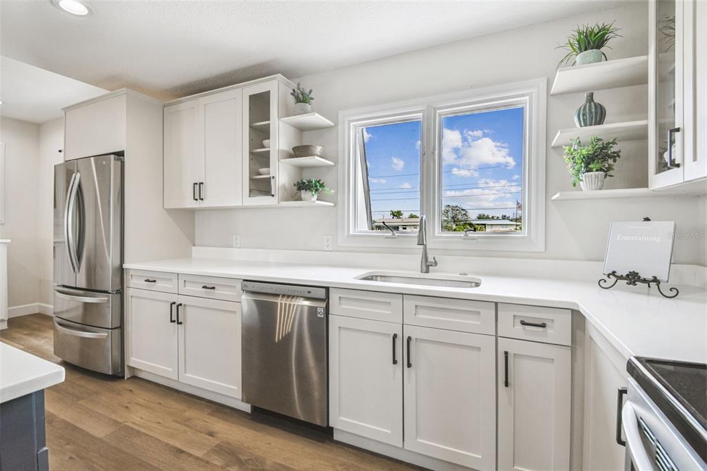 4907 Beacon Road Palmetto, FL 34221 - Photo 21 of 80 a kitchen with a sink stove and refrigerator