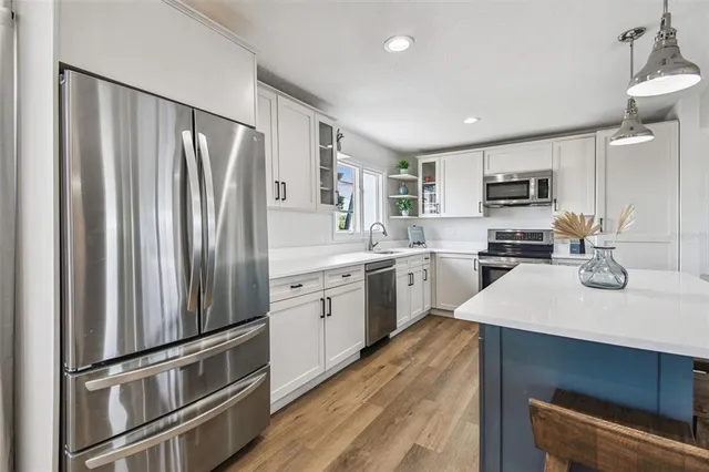 a bedroom with bed and a couch