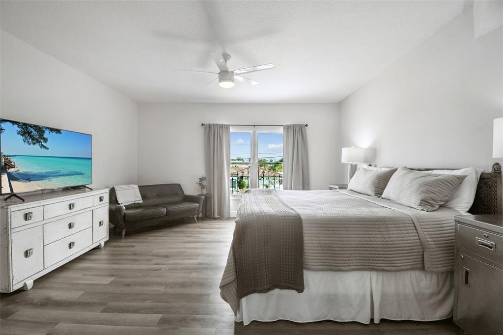 4907 Beacon Road Palmetto, FL 34221 - Photo 24 of 80 a bedroom with a bed and a dresser